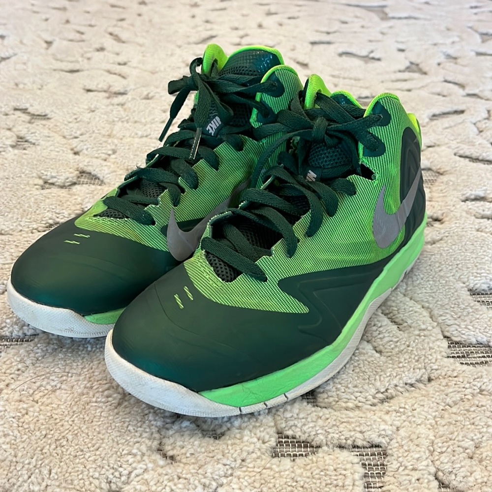 Nike mid-top size 6Y court shoes.